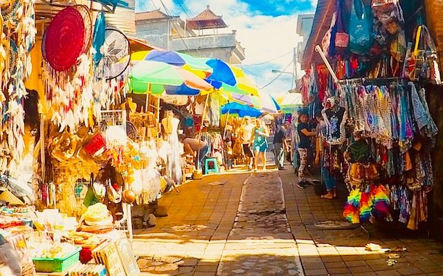 Admiring Handcrafted Wooden Bowls at Ubud Art Market, Bali